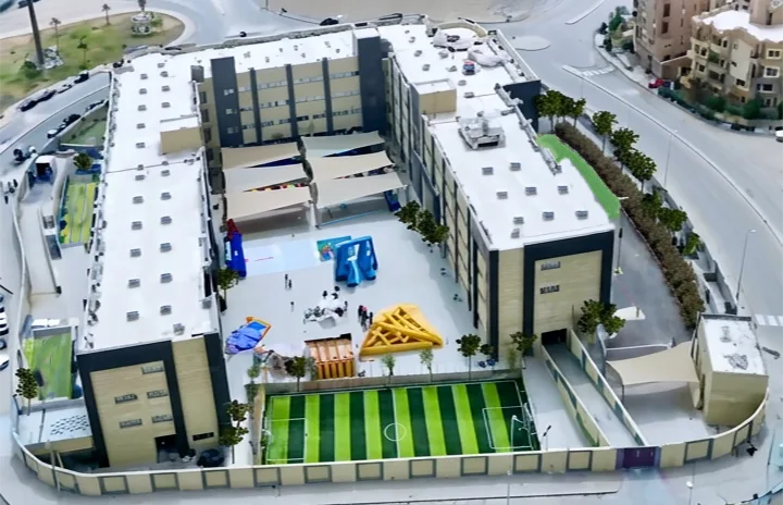 Aerial view into the Eternity School of Egypt courtyard and sports field